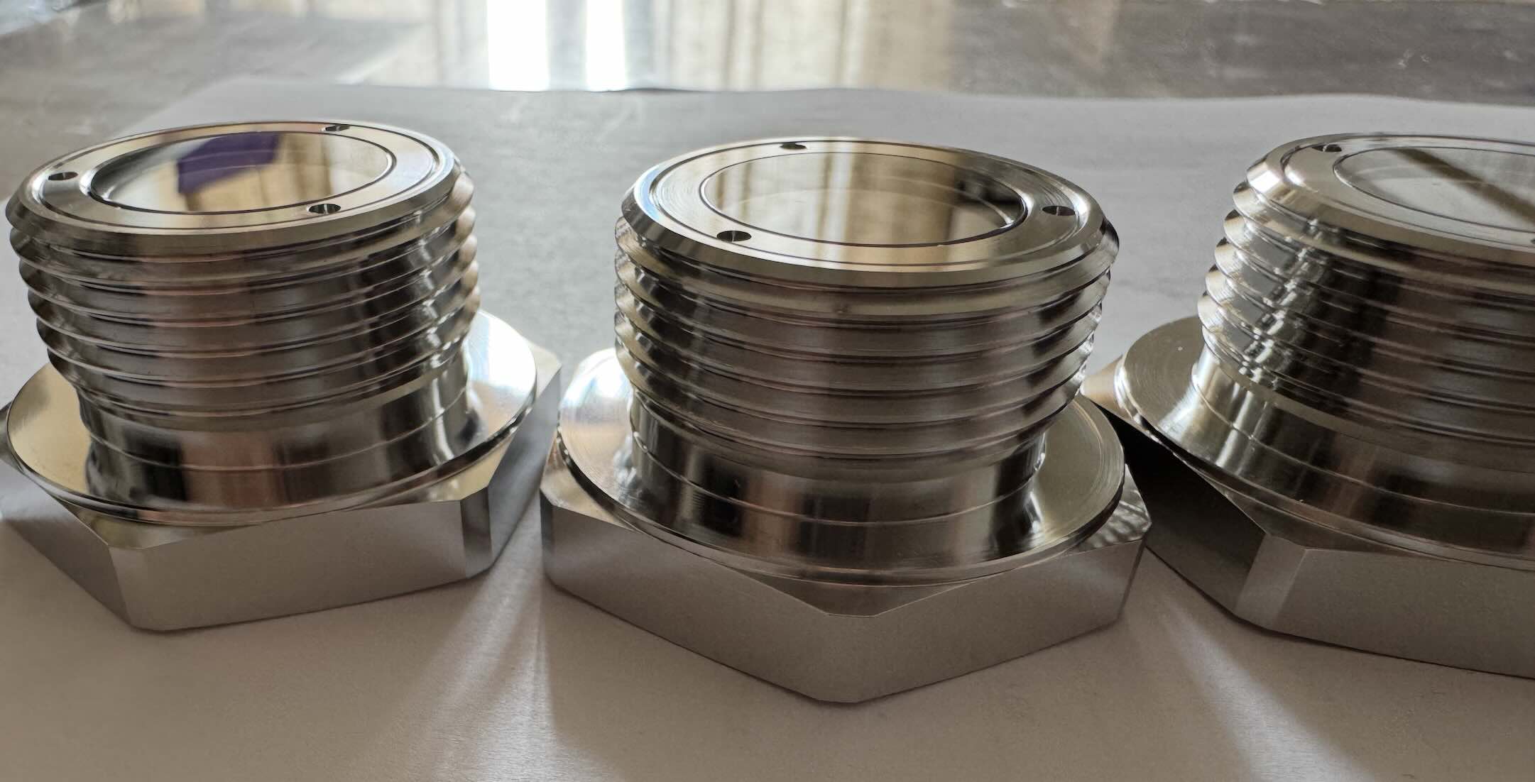 SAE sight glasses. Notice smooth transition between the glass and the housing.